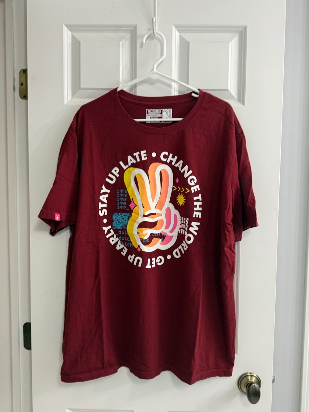 Dutch Bros Maroon Unisex Tee with Multicolor Peace Graphic